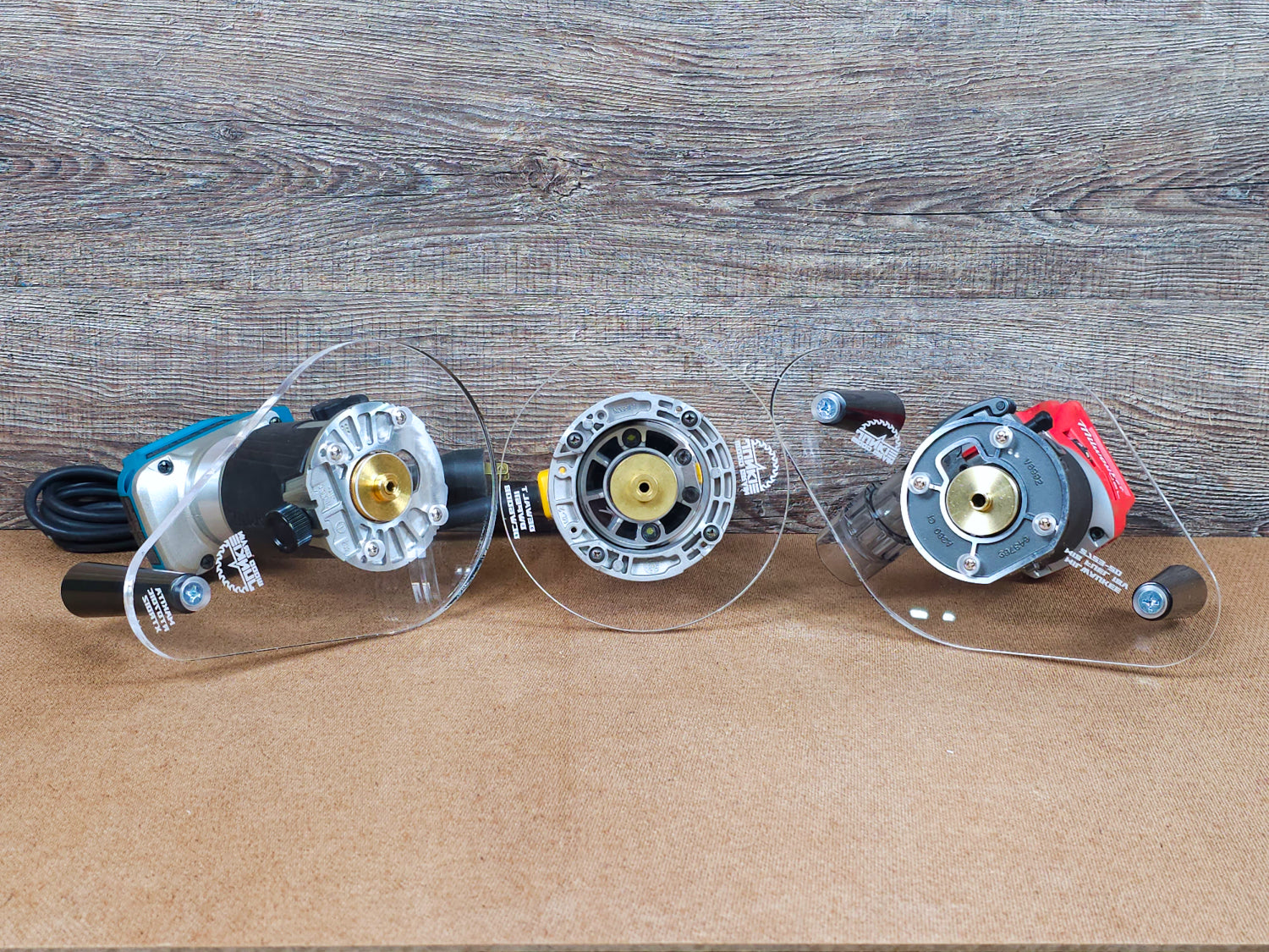 Selection of trim routers and the thick acrylic base plates offered by Wood Grain Junkie