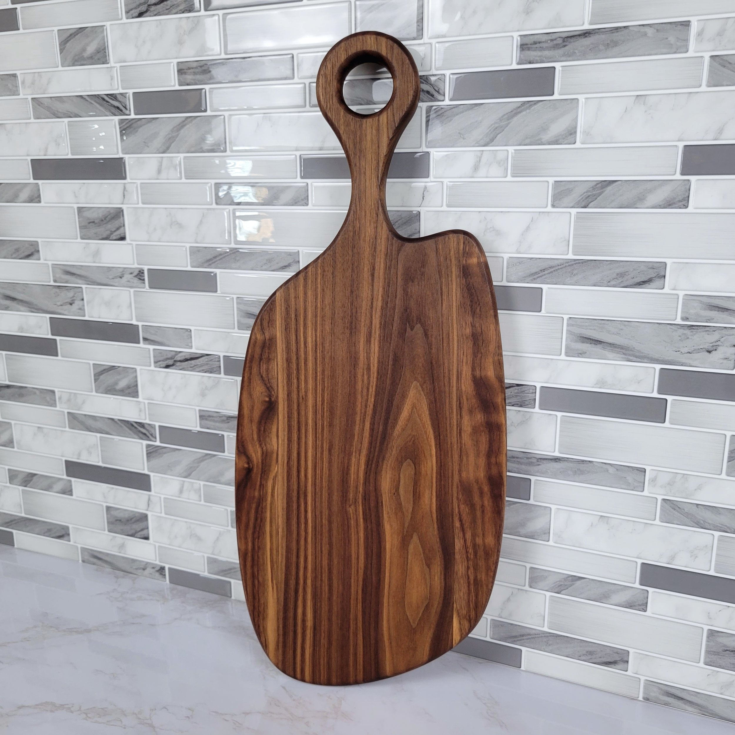 Wood Grain Junkie Black Walnut Charcuterie Board with Organic Curves and Round Handle