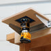 Router attached to a router table on a workbench.