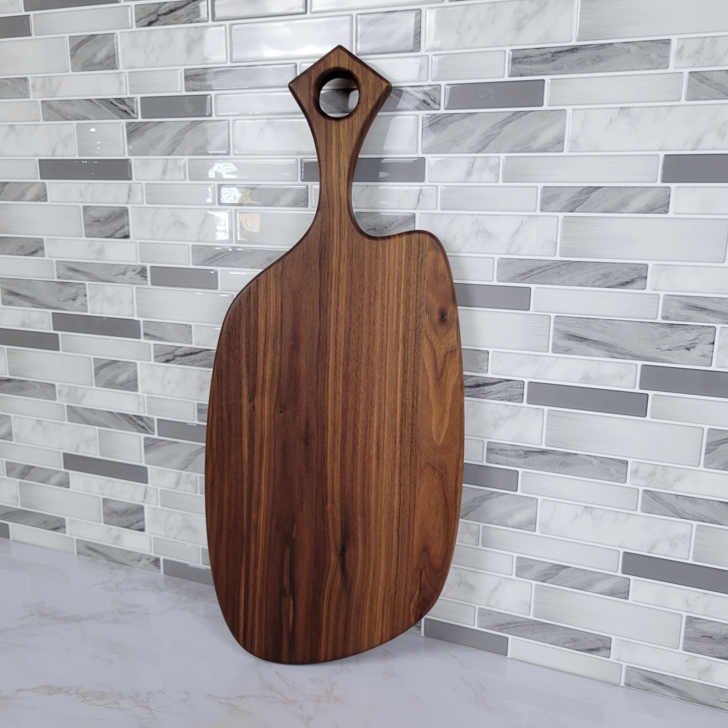 Wood Grain Junkie Black Walnut Charcuterie Board with Organic Curves and Modern Handle