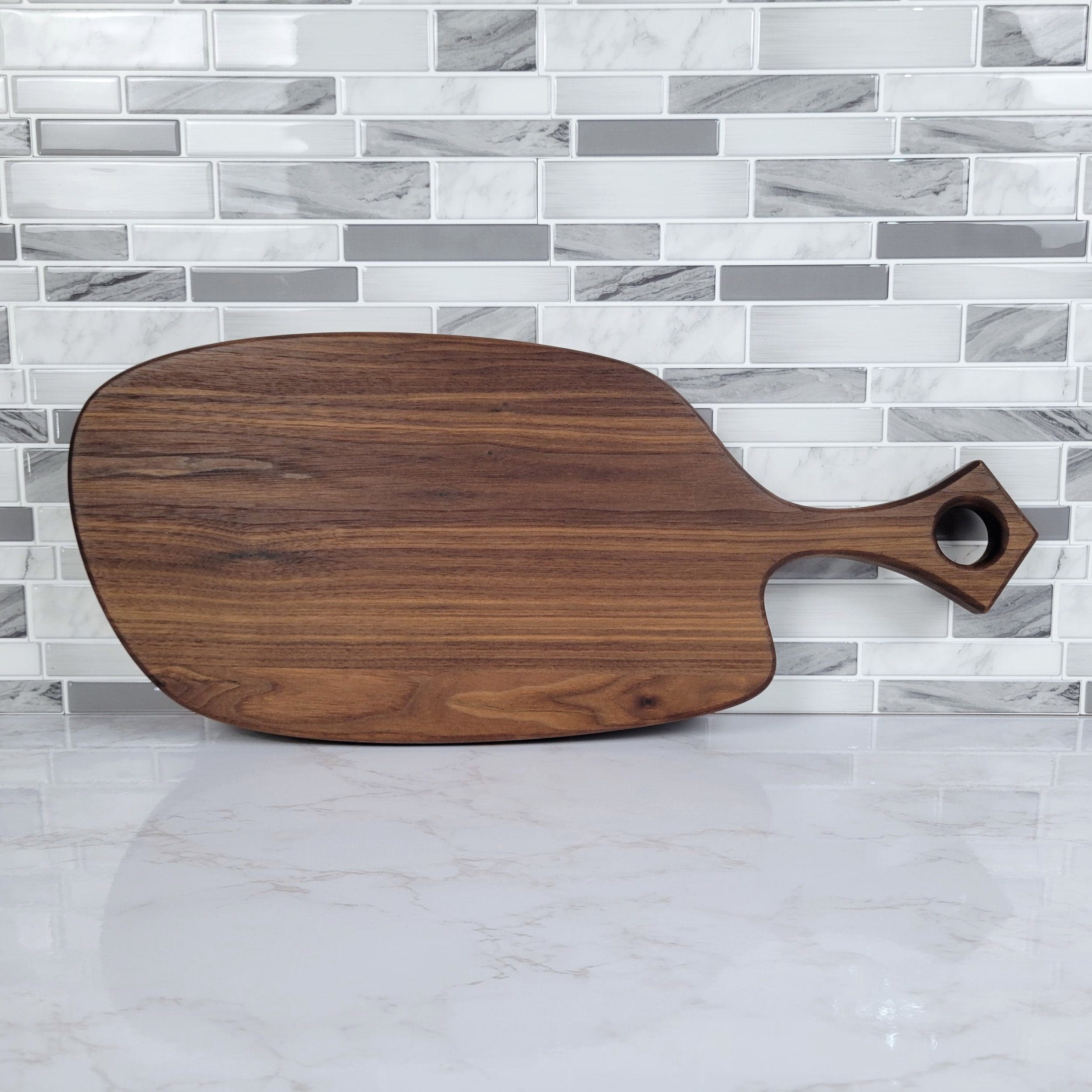 Wood Grain Junkie Black Walnut Charcuterie Board with Organic Curves and Modern Handle