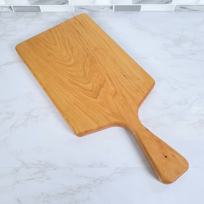 Wood Grain Junkie Cherry Charcuterie Board with a Sleek Modern Handle